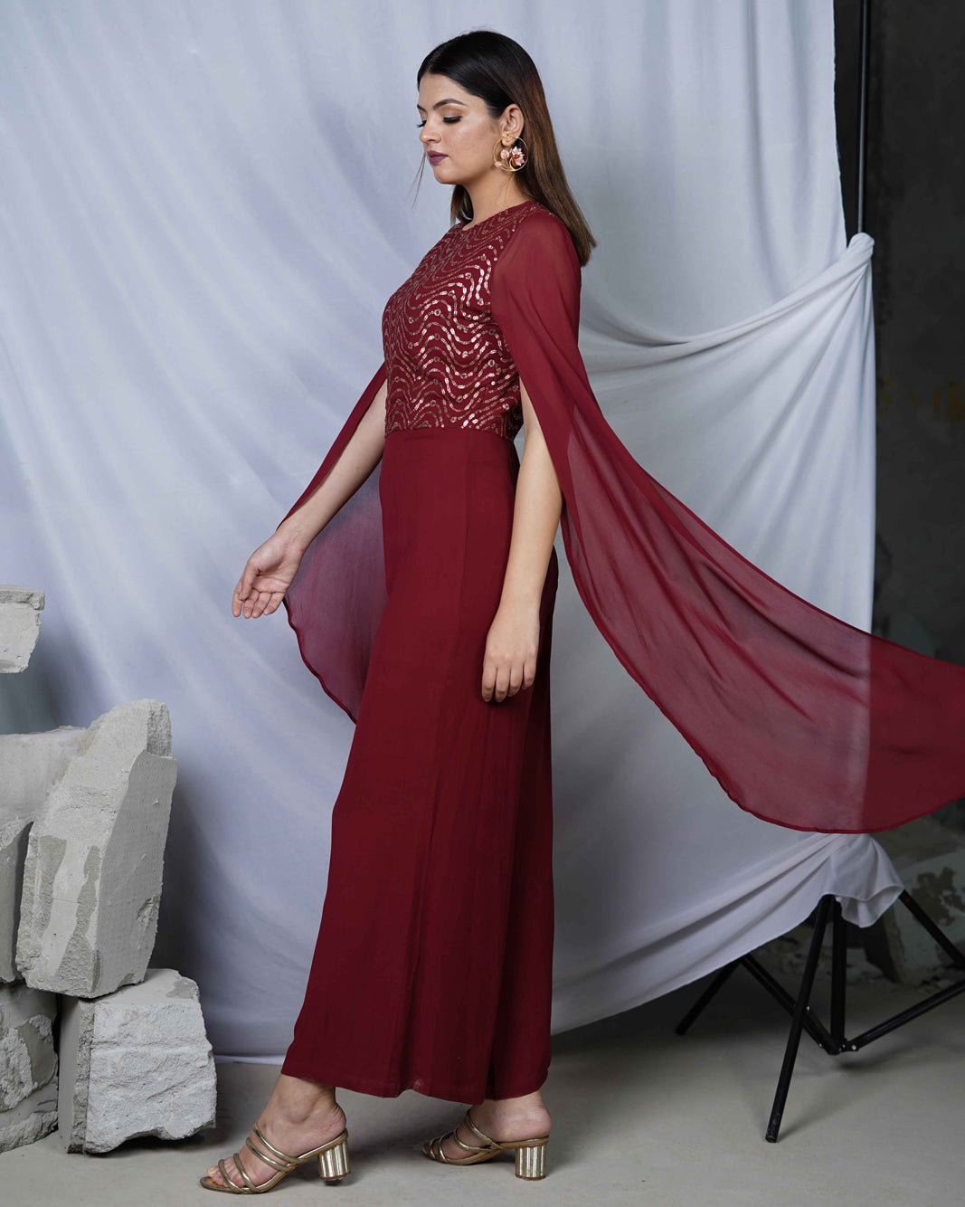 Nazuk Maroon Indo- Western Party Jumpsuit with Cape Sleeves and Gold Embroidery Details for Cocktail