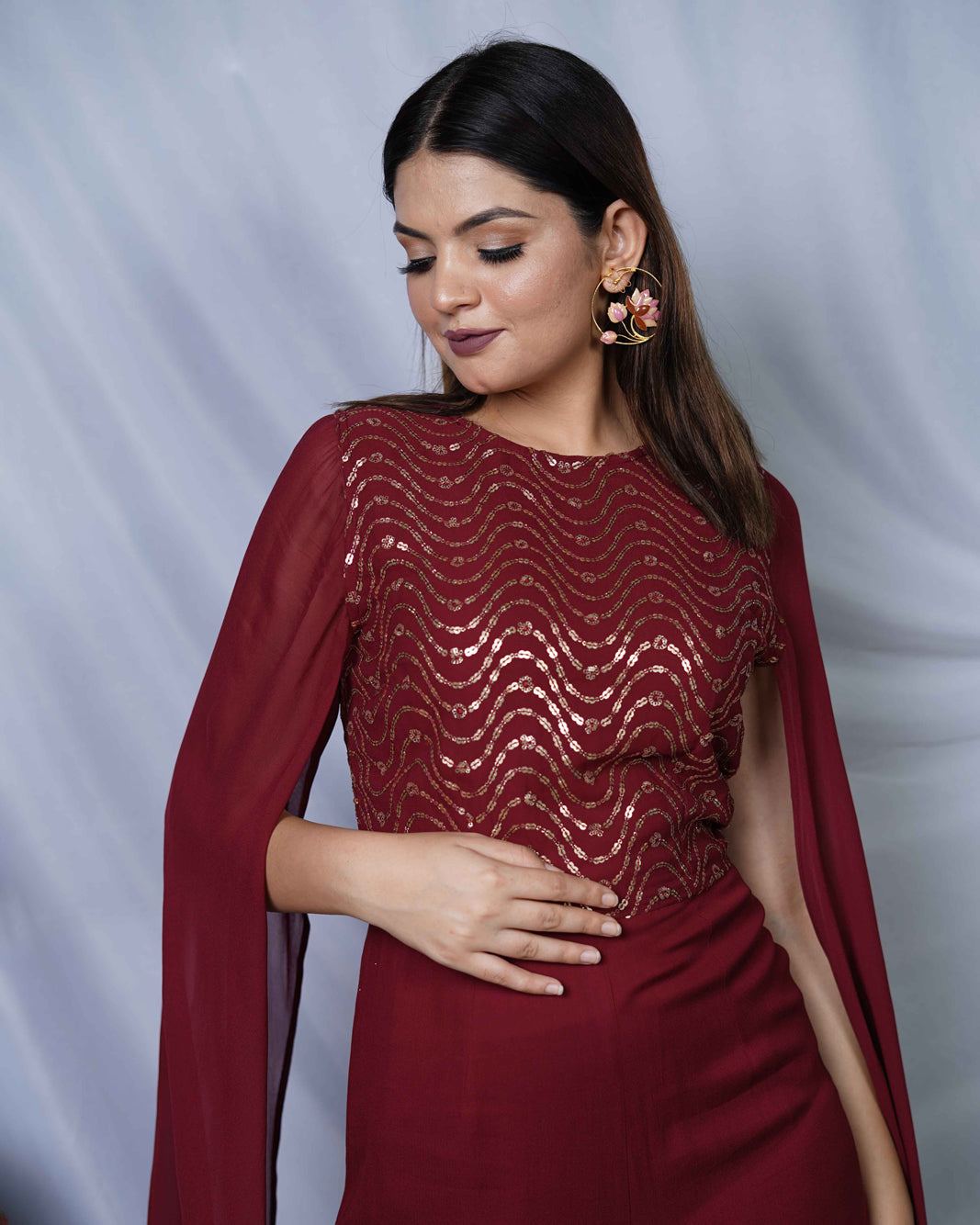 Nazuk Maroon Indo- Western Party Jumpsuit with Cape Sleeves and Gold Embroidery Details for Cocktail